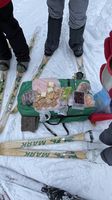 Assorted food items laid out on a green gear bag