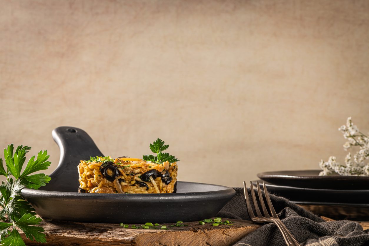 Side view of dish in a black ceramic pan