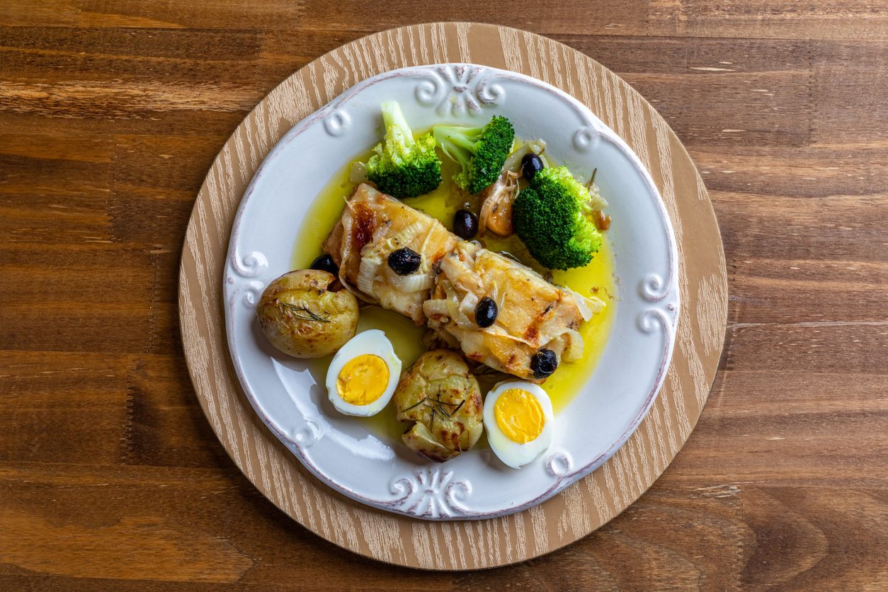 Top-down view of the plated dish on a wooden table.