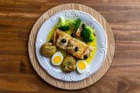 Top-down view of the plated dish on a wooden table.