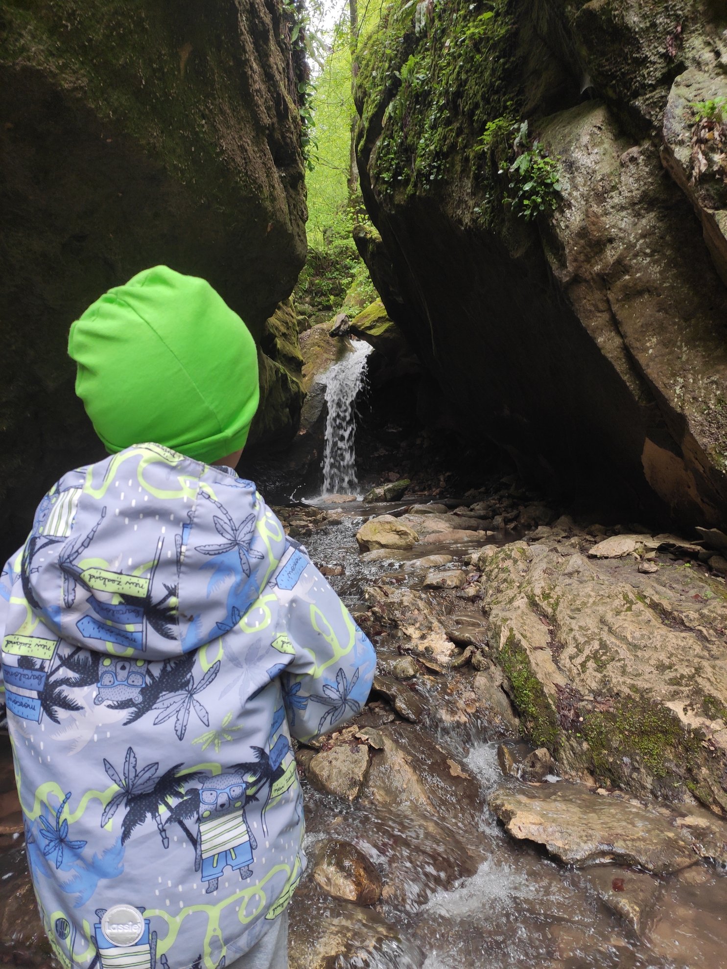 small waterfall between large boulders
