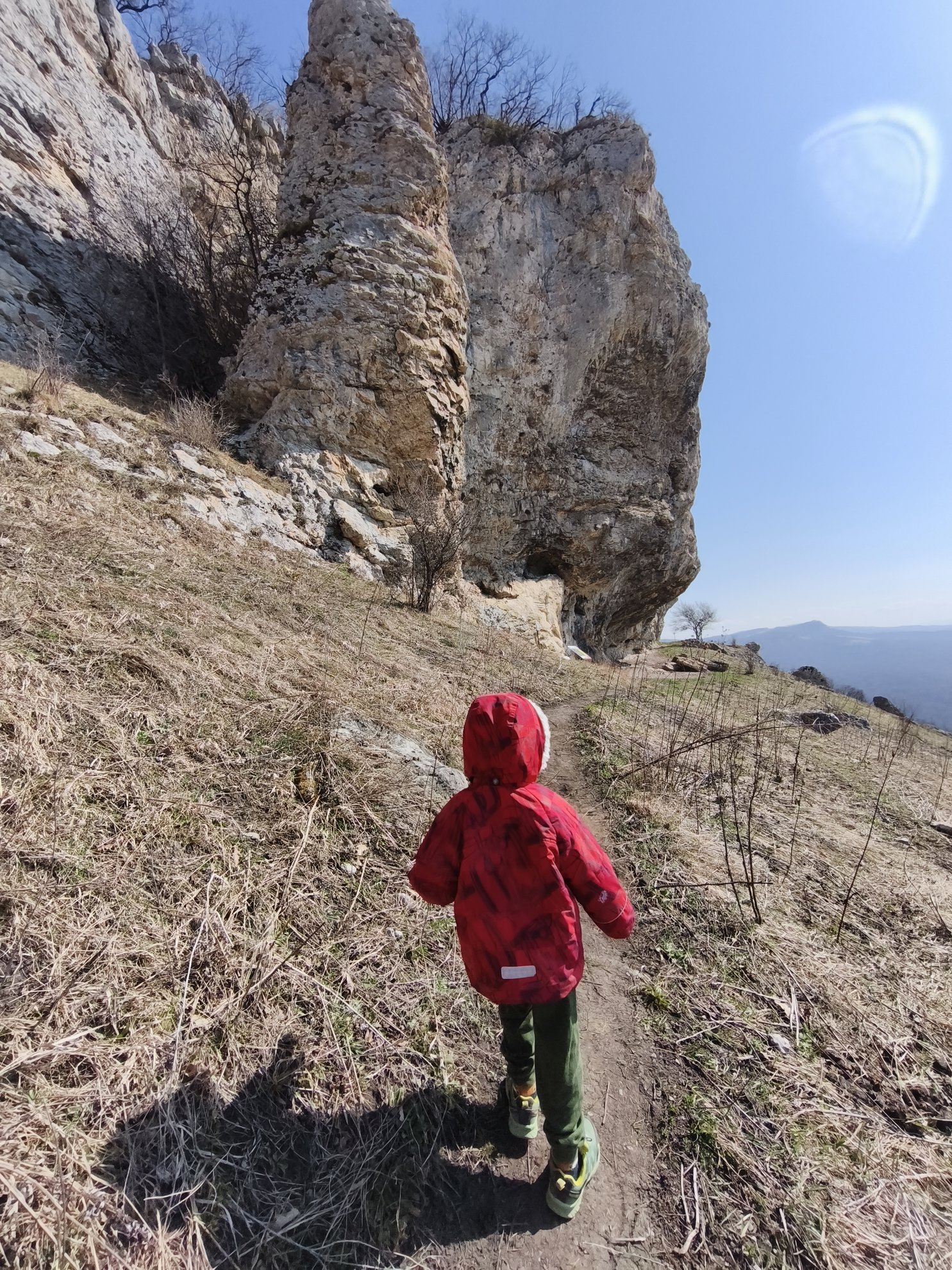 hiking path leading toward tall rock formations