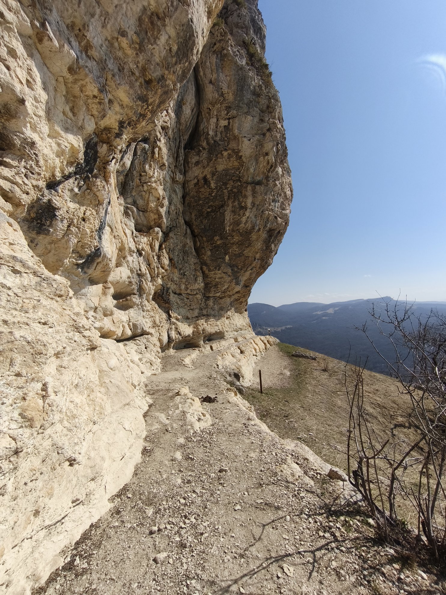 hiking path along the base of a rock cliff