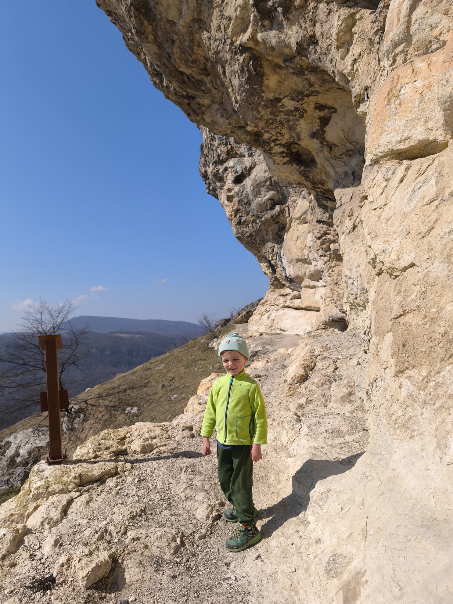 Hiking path along the base of a rock overhang